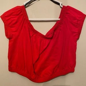 Cropped red top off shoulder